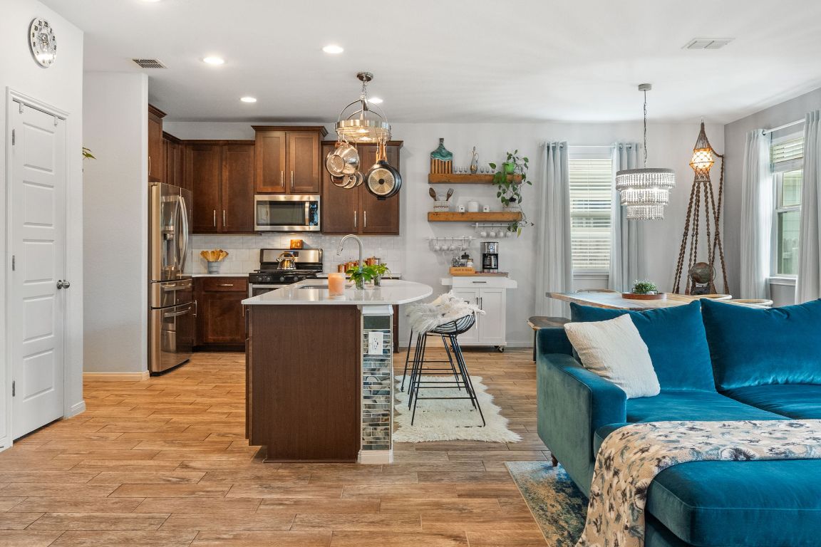 1306 Falconer Way Austin, TX 78748 - Photo 36 of 39 Easily stay connected throughout the main floor with this fabulous entertainer's open floor plan.