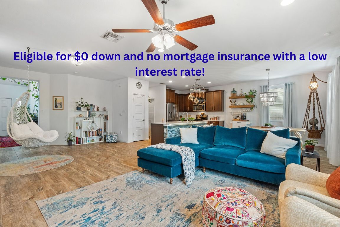 1306 Falconer Way Austin, TX 78748 - Photo 2 of 39 The spacious living room flows effortlessly into the kitchen and dining area.