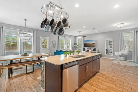 a kitchen with a sink cabinets and window
