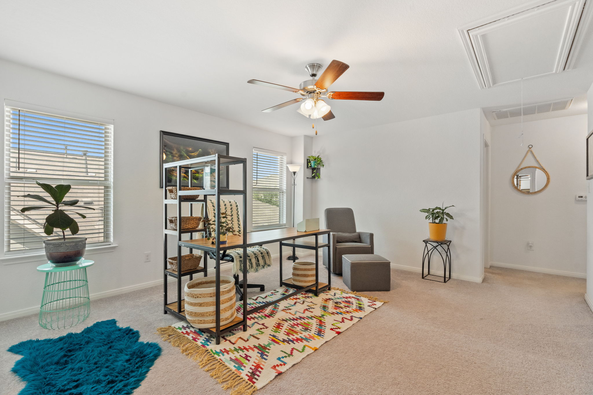 1306 Falconer Way Austin, TX 78748 - Photo 23 of 39 a view of a livingroom with furniture and a ceiling fan