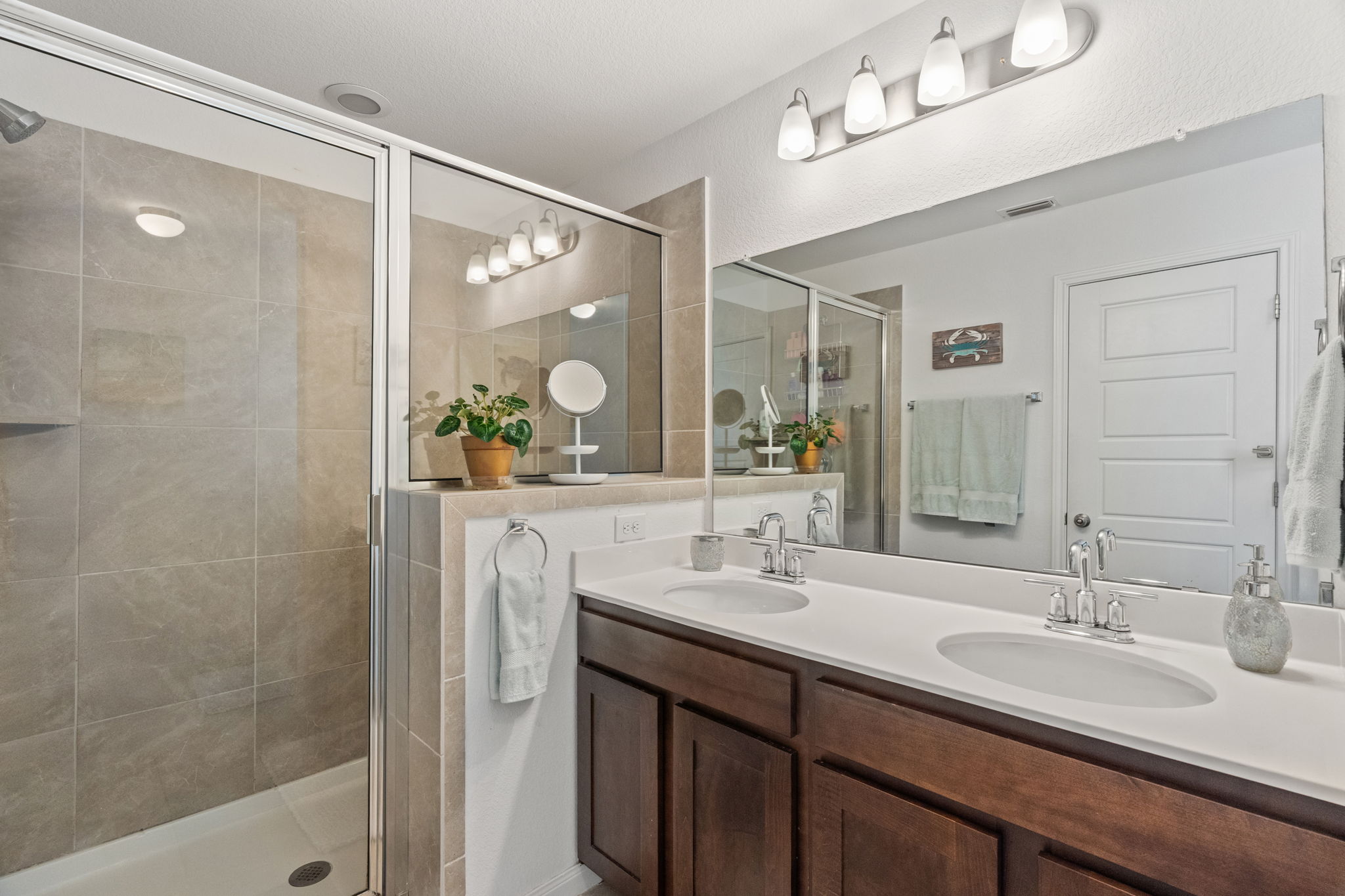1306 Falconer Way Austin, TX 78748 - Photo 29 of 39 a bathroom with a double vanity sink mirror and double