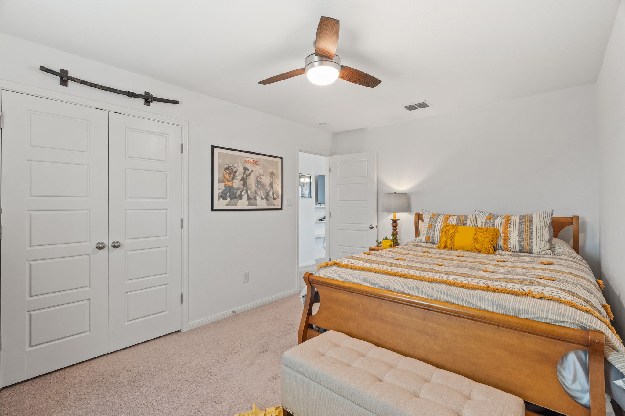 1306 Falconer Way Austin, TX 78748 - Photo 30 of 39 a bedroom with a bed and a chandelier