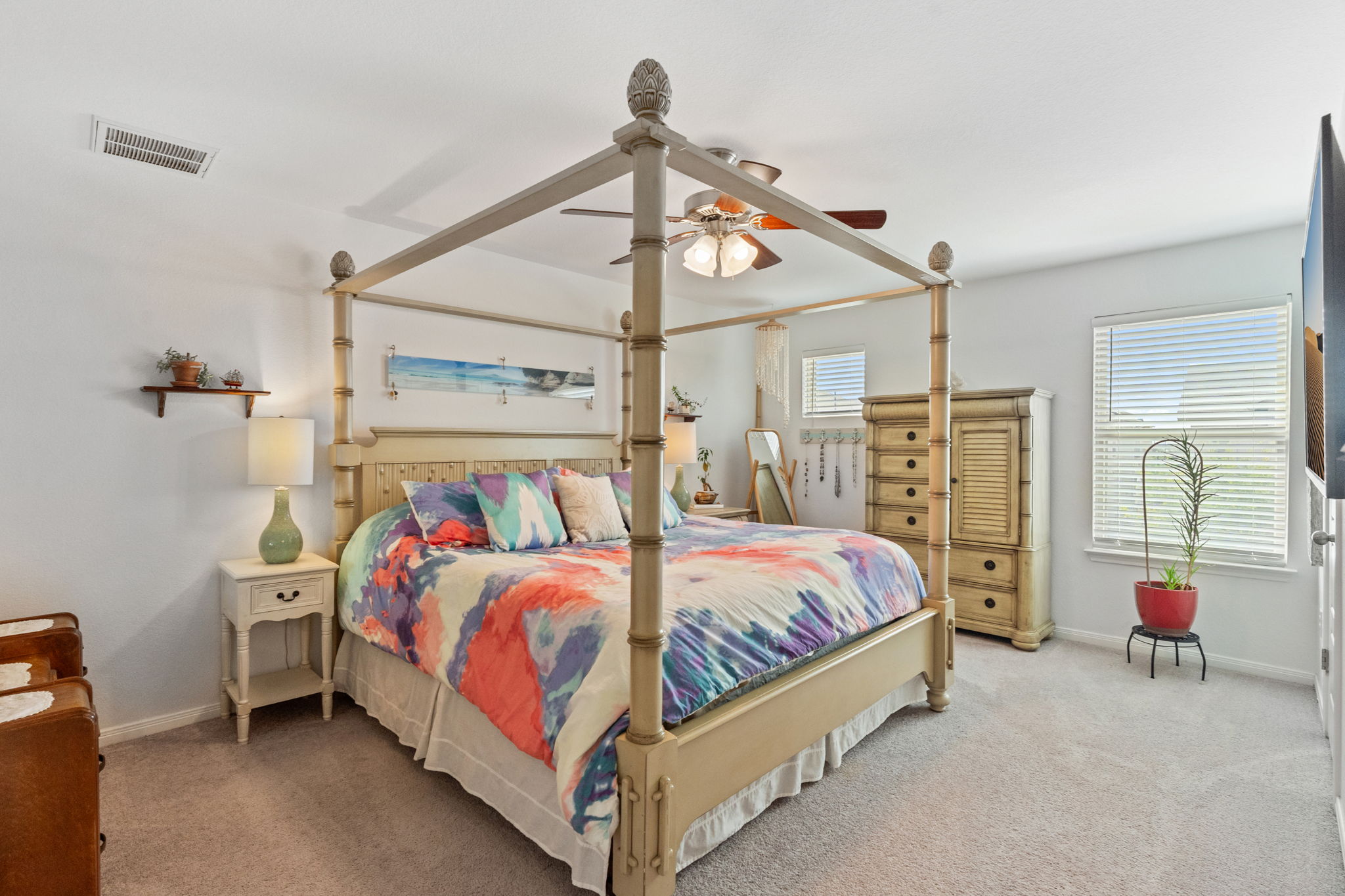 1306 Falconer Way Austin, TX 78748 - Photo 6 of 39 a bedroom with a bed a couch and dresser