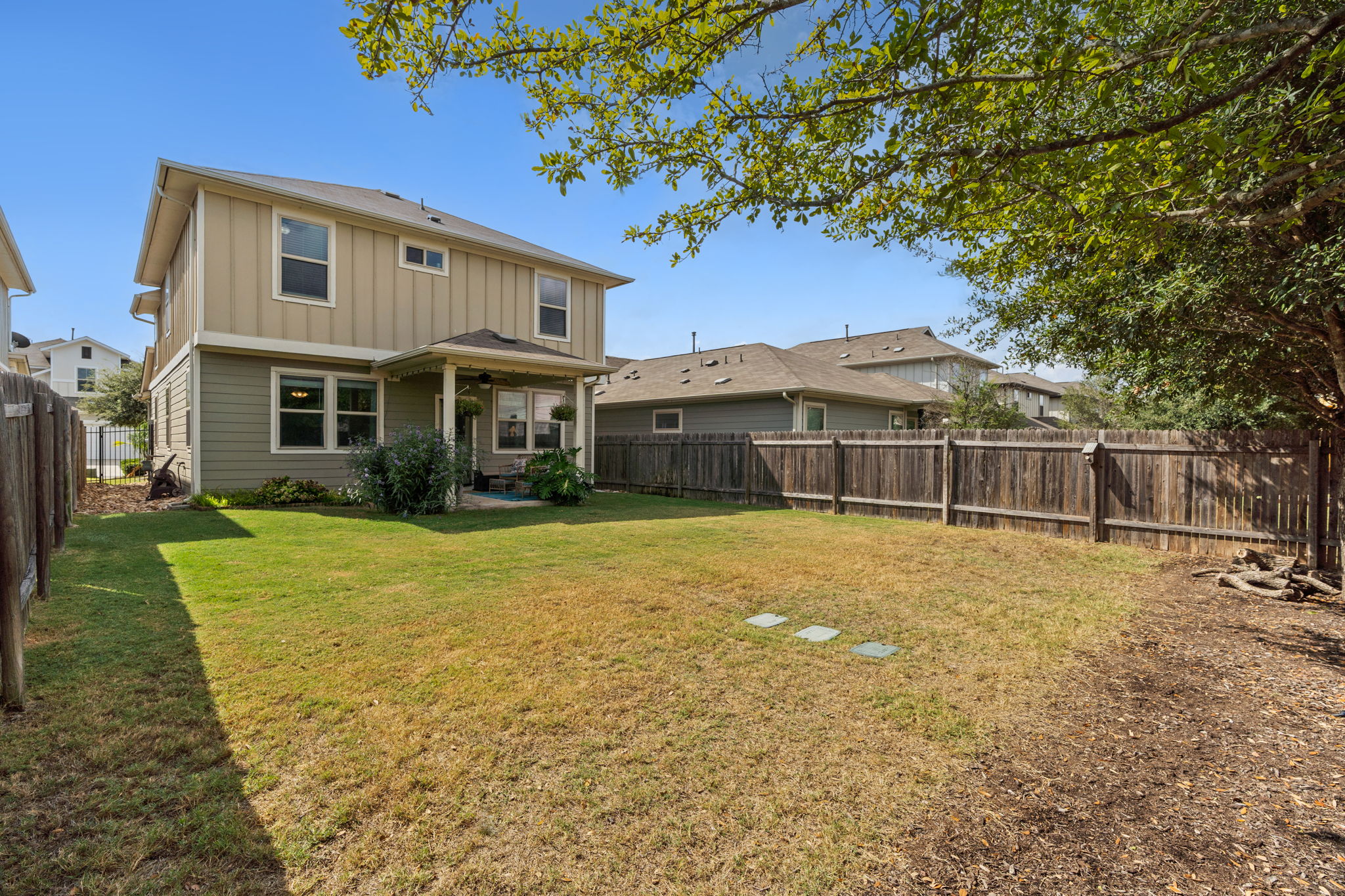 1306 Falconer Way Austin, TX 78748 - Photo 7 of 39 a front view of a house with a garden