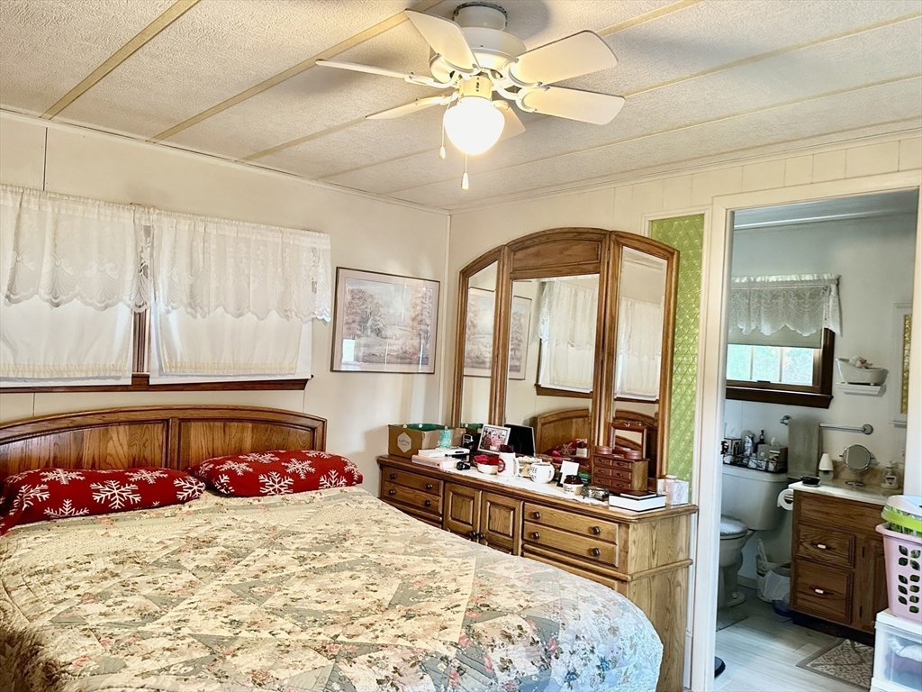 45 Clems Way Acushnet, MA 02743 - Photo 11 of 18 a bed room with a bed mirror and a dresser