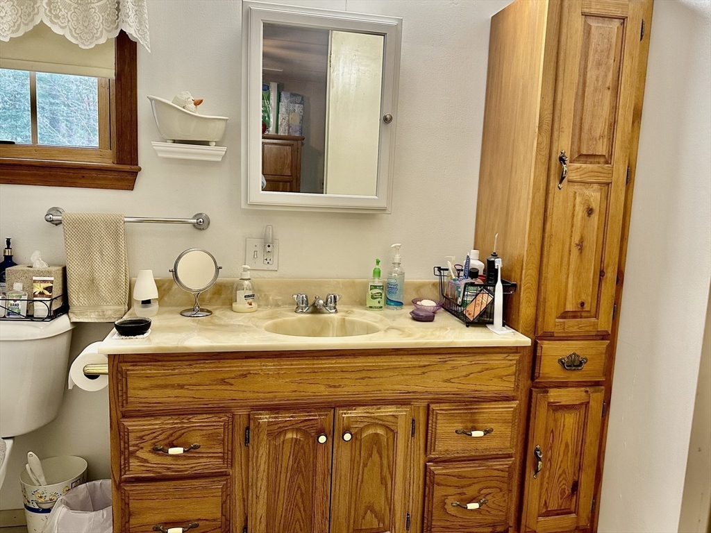 45 Clems Way Acushnet, MA 02743 - Photo 12 of 18 a bathroom with a sink and a mirror