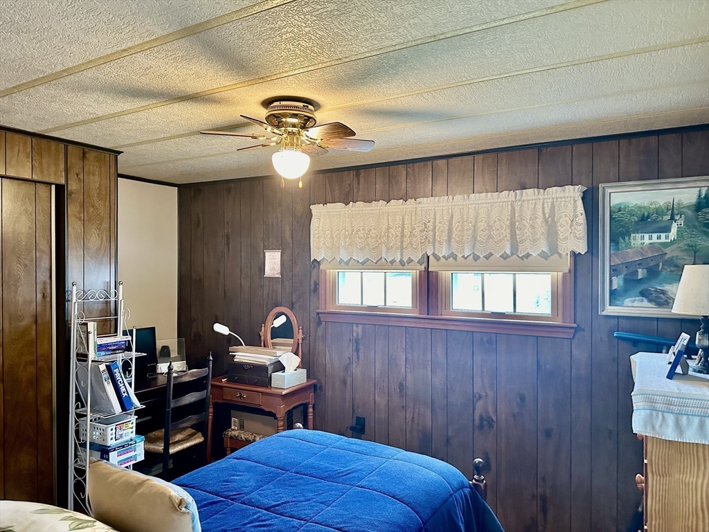 45 Clems Way Acushnet, MA 02743 - Photo 14 of 18 a bedroom with a bed and wooden floor