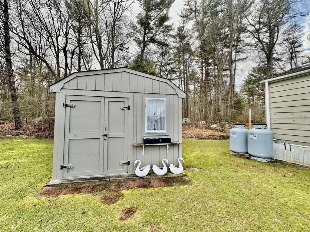 45 Clems Way Acushnet, MA 02743 - Photo 17 of 18 a front view of a house with garden