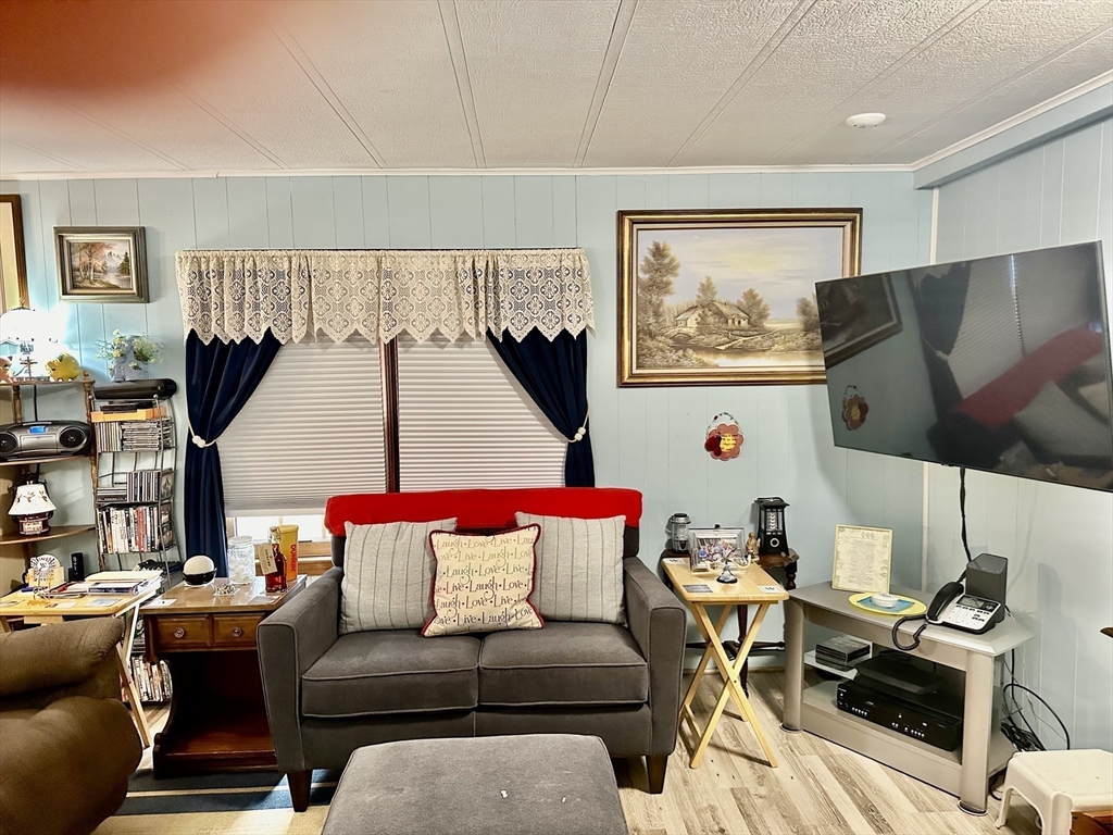 45 Clems Way Acushnet, MA 02743 - Photo 5 of 18 a living room with furniture and a flat screen tv