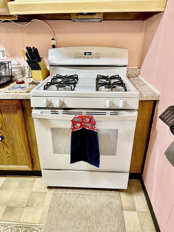 45 Clems Way Acushnet, MA 02743 - Photo 8 of 18 a white stove top oven sitting inside of a kitchen
