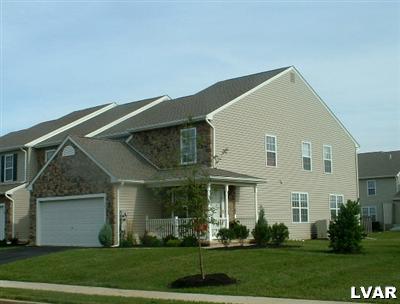 4134 Walter Road Bethlehem, PA 18020 - Photo 1 of 7 a view of a white house next to a yard