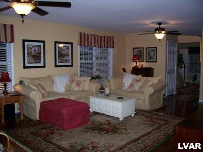 4134 Walter Road Bethlehem, PA 18020 - Photo 3 of 7 a living room with furniture and a chandelier