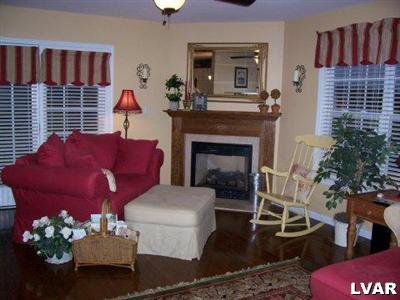 4134 Walter Road Bethlehem, PA 18020 - Photo 7 of 7 a living room with furniture wooden floor and a fireplace