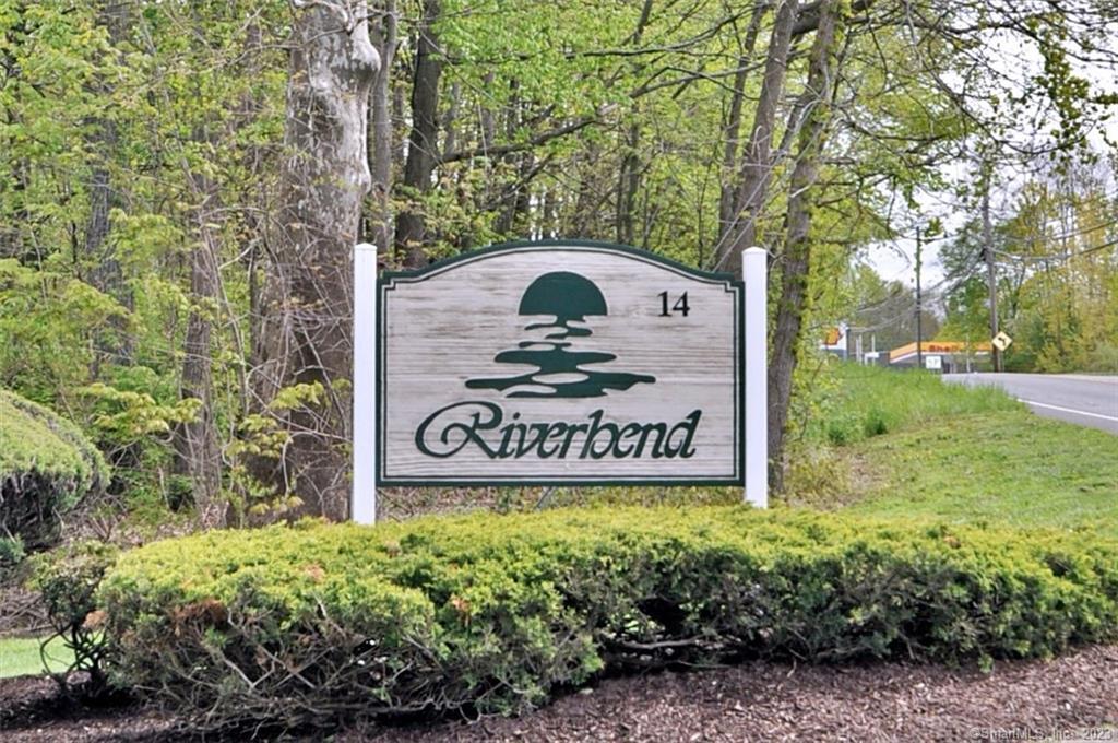 14 Newtown Road, Unit B15 Danbury, CT 06810 - Photo 1 of 1 a sign broad in front of a tree