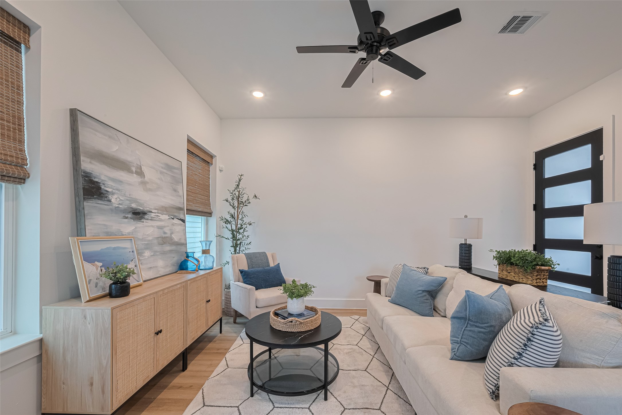 1462 Ferguson Way Houston, TX 77088 - Photo 11 of 24 a living room with furniture and a painting on the wall