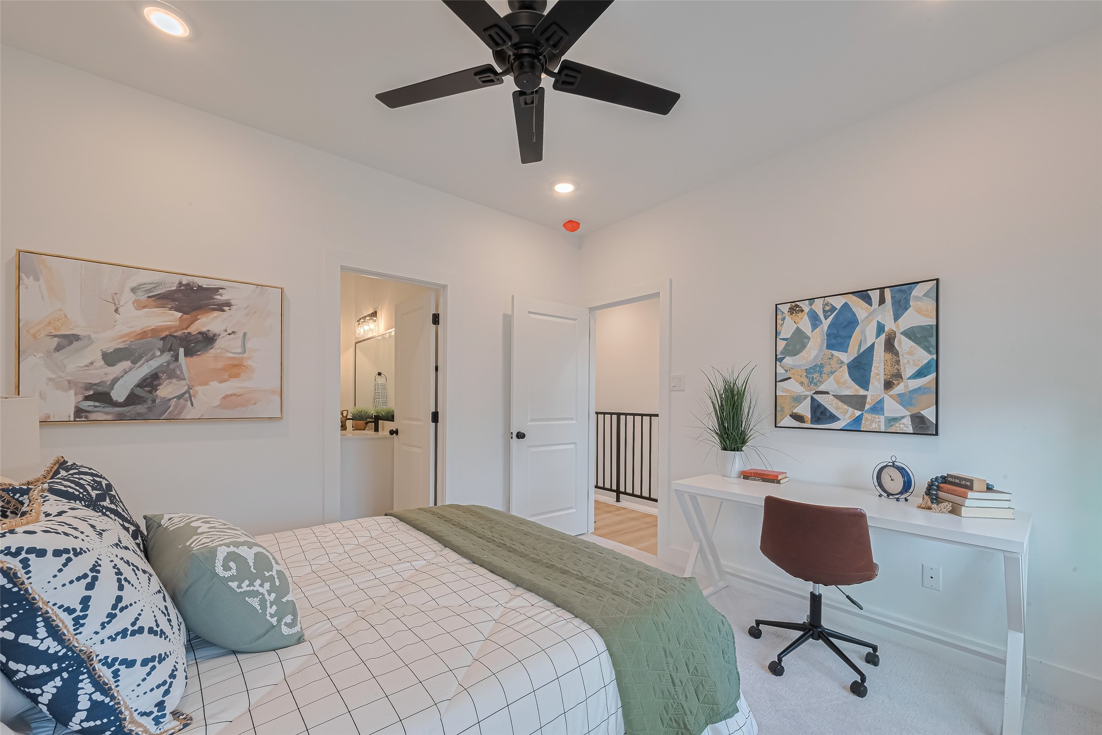 1462 Ferguson Way Houston, TX 77088 - Photo 15 of 24 a bedroom with a bed and a chandelier