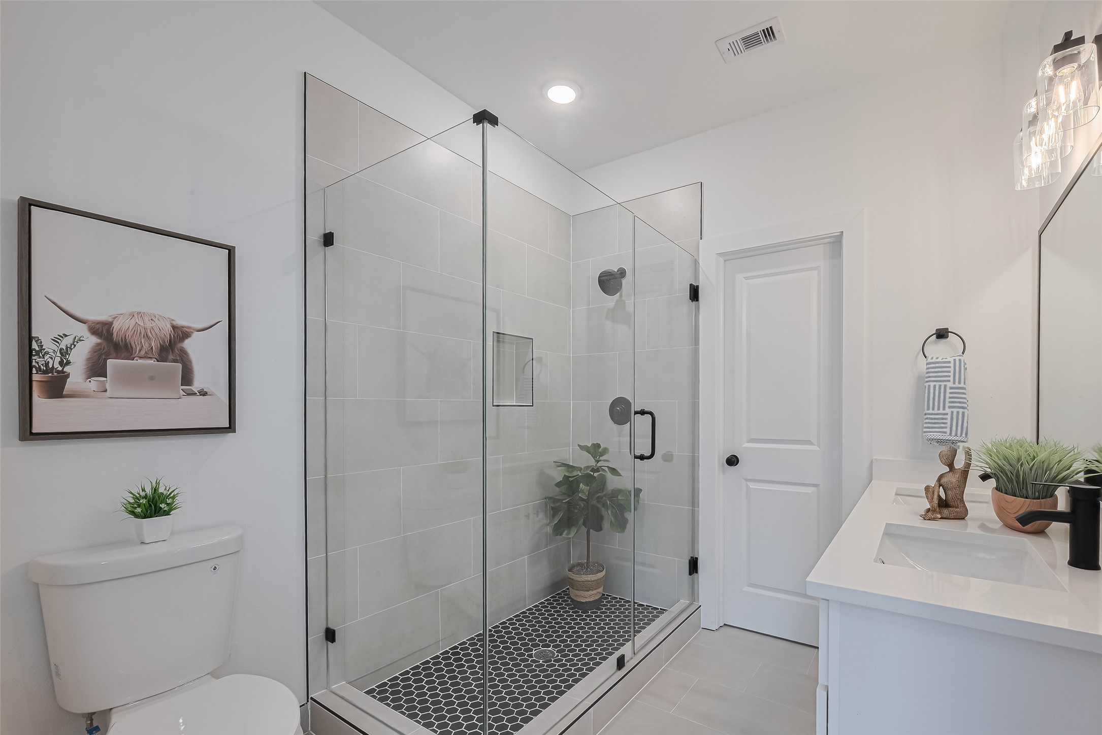 1462 Ferguson Way Houston, TX 77088 - Photo 18 of 24 a bathroom with a shower a toilet and a sink