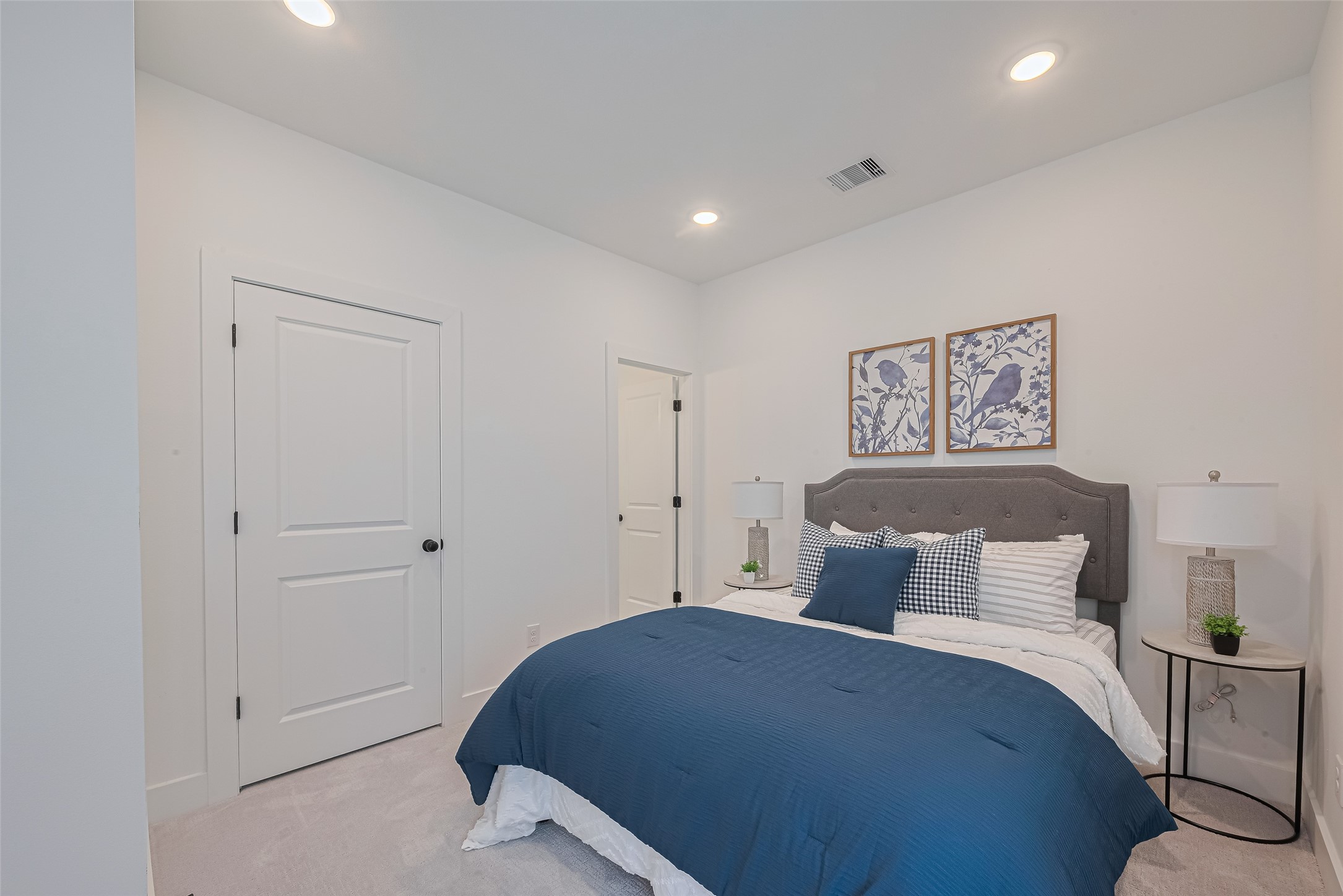 1462 Ferguson Way Houston, TX 77088 - Photo 20 of 24 a bedroom with a bed and painting on the wall