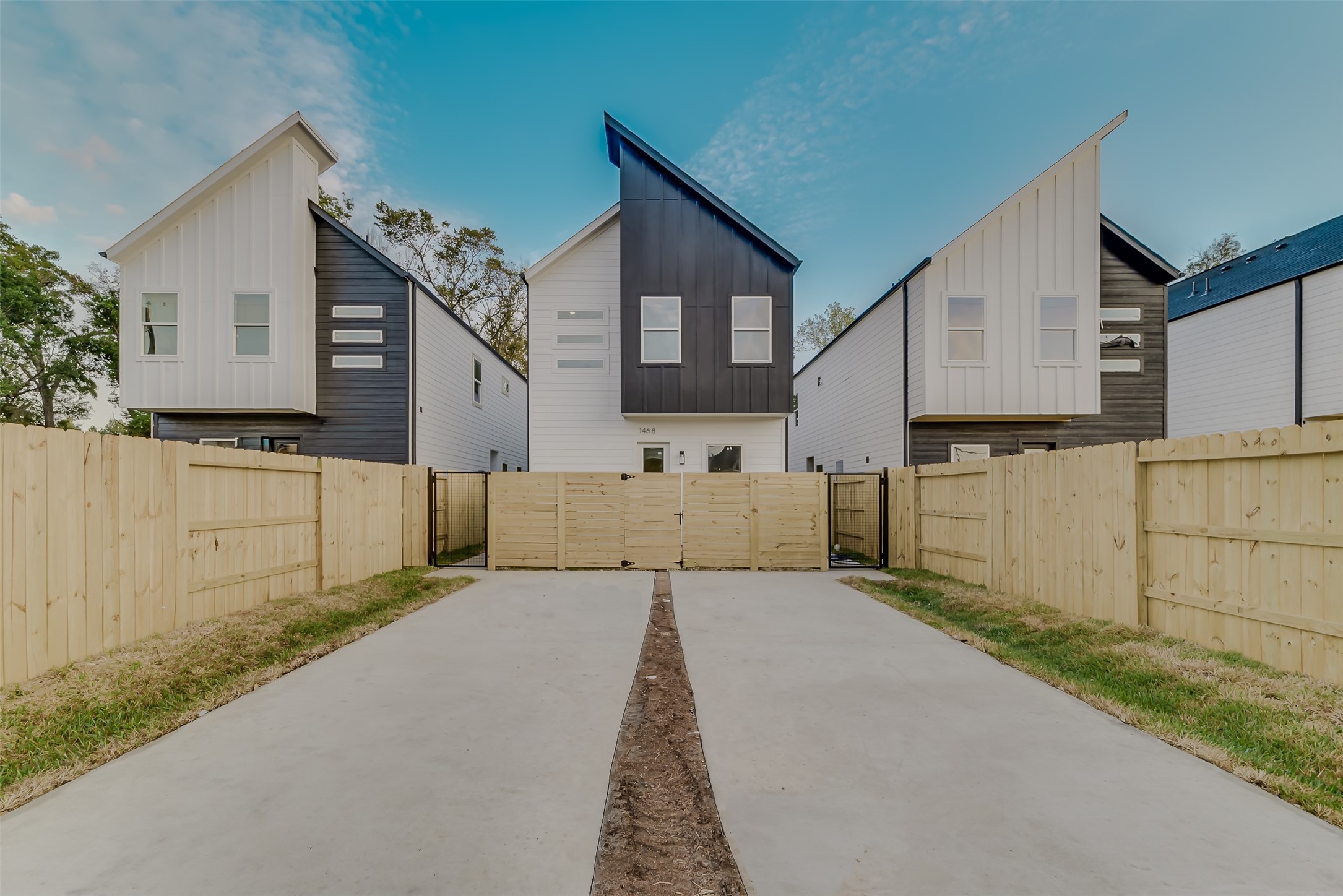 1462 Ferguson Way Houston, TX 77088 - Photo 2 of 24 a view of a house with a small yard and wooden fence