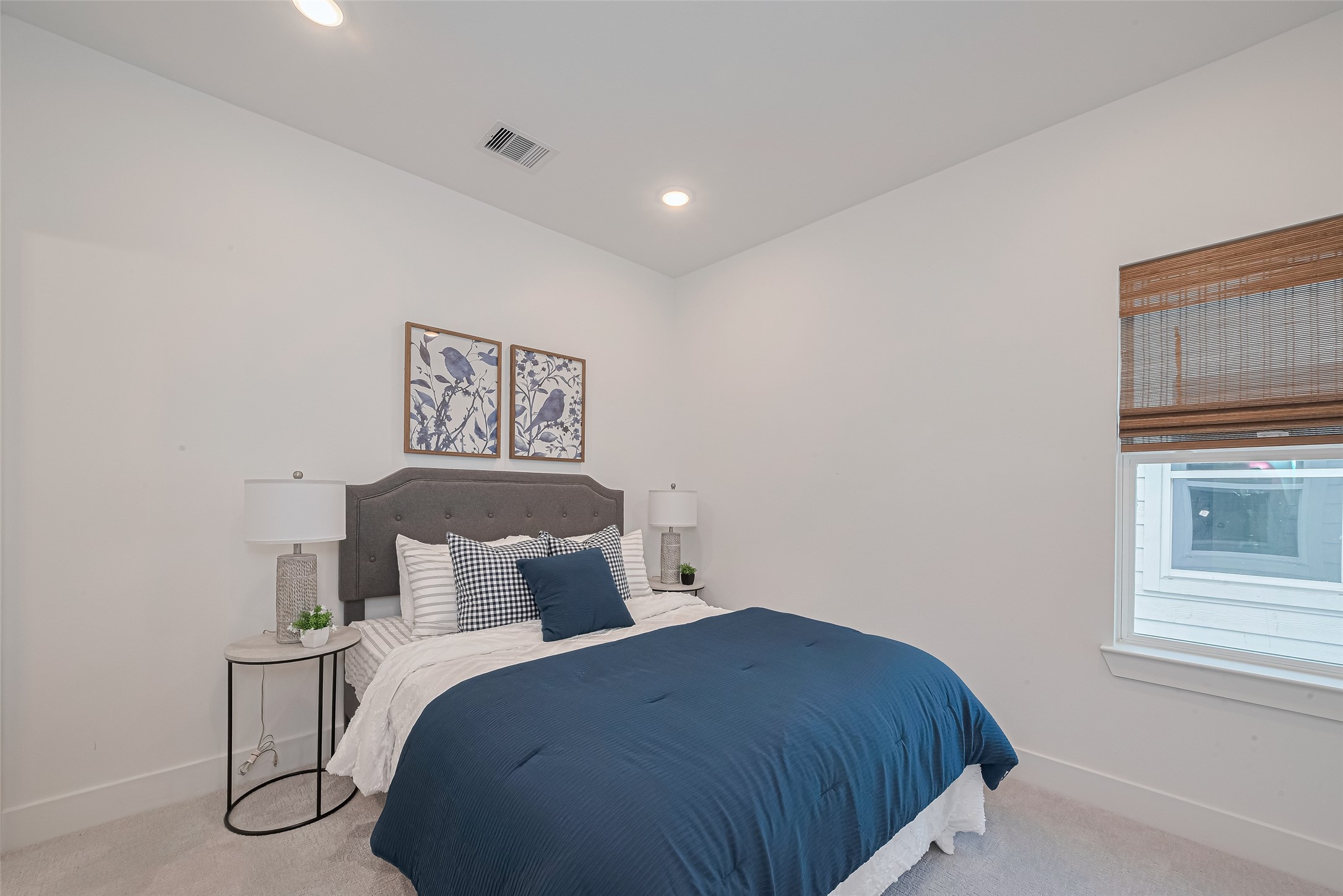 1462 Ferguson Way Houston, TX 77088 - Photo 21 of 24 a bedroom with a bed and night stand