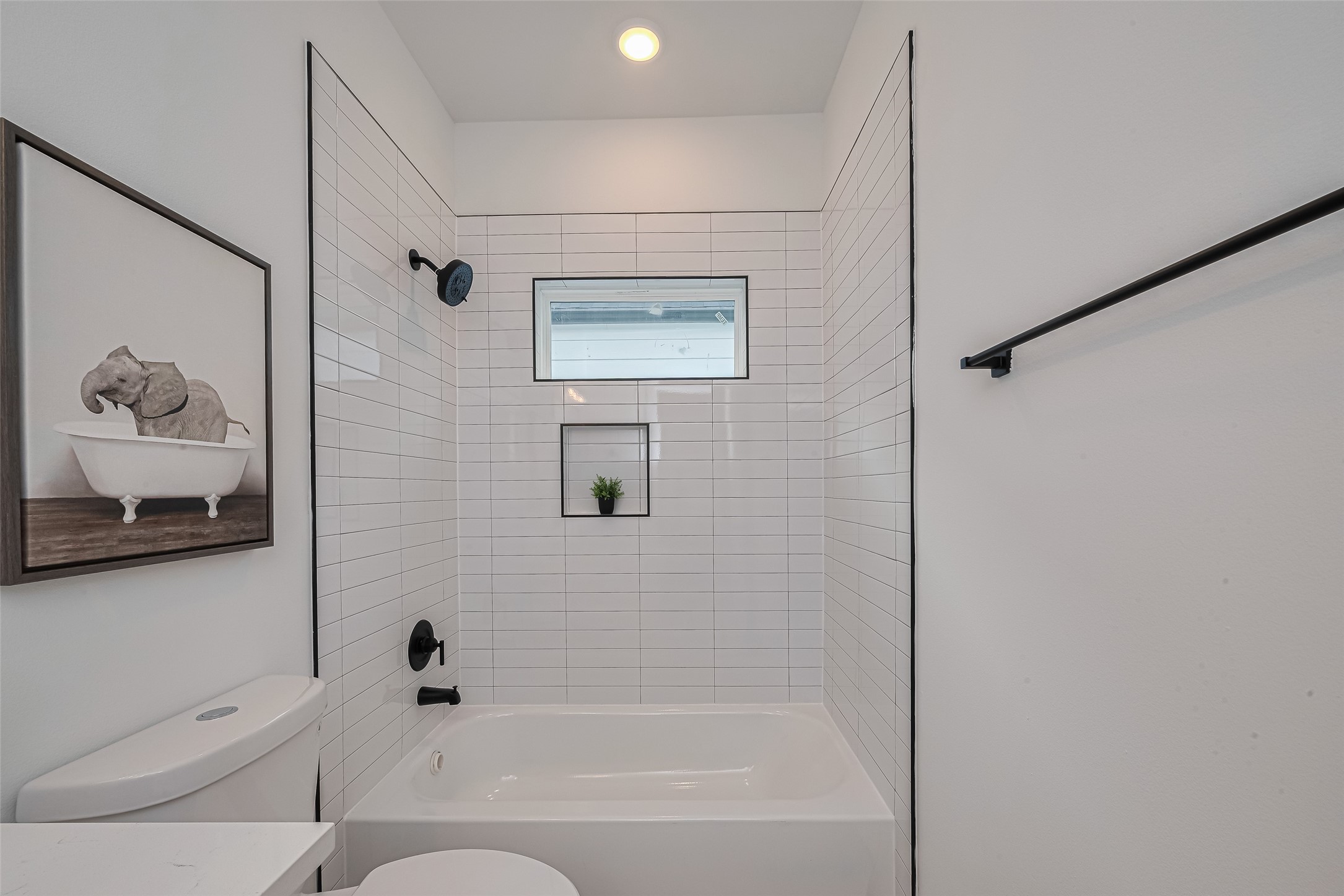 1462 Ferguson Way Houston, TX 77088 - Photo 22 of 24 a bathroom with a bathtub and shower