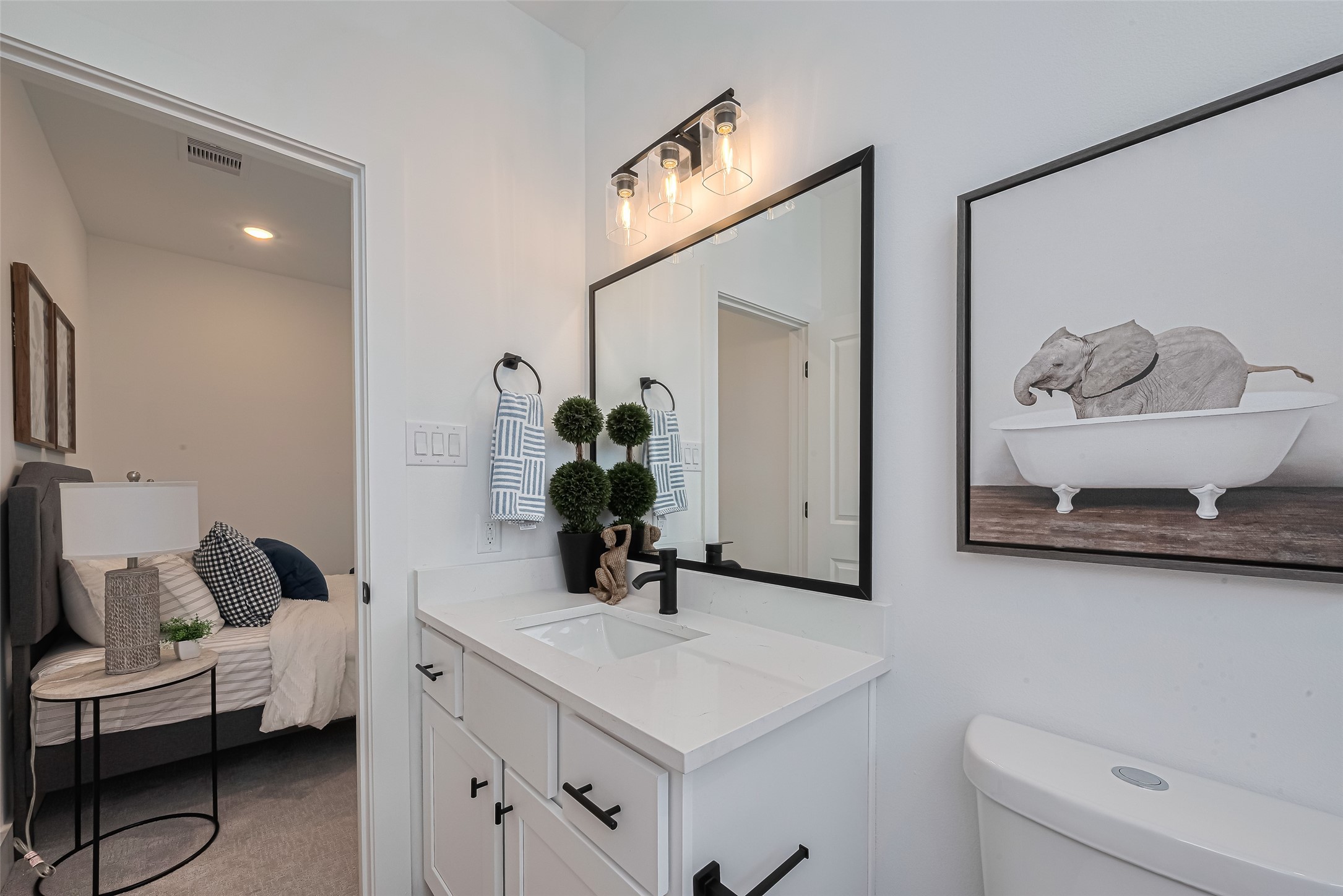 1462 Ferguson Way Houston, TX 77088 - Photo 5 of 24 a bathroom with a sink and a mirror