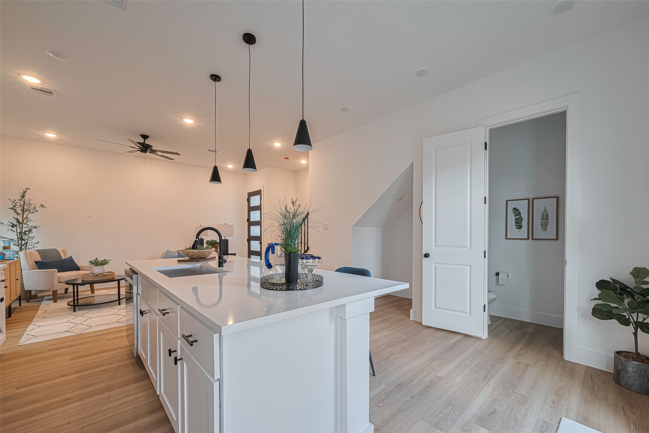 1462 Ferguson Way Houston, TX 77088 - Photo 8 of 24 a kitchen with sink a stove and wooden floor