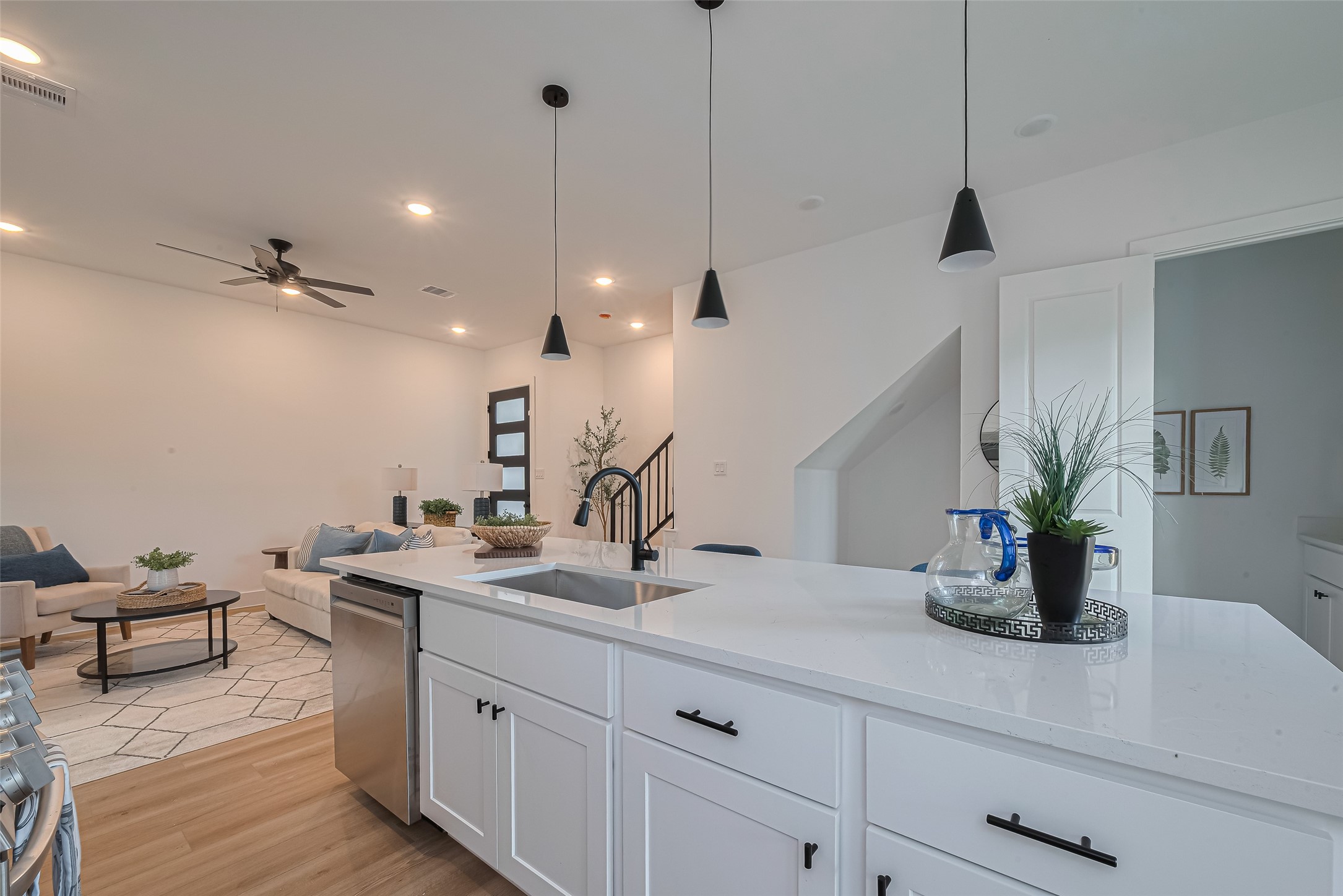1462 Ferguson Way Houston, TX 77088 - Photo 10 of 24 a kitchen with a sink and a potted plant