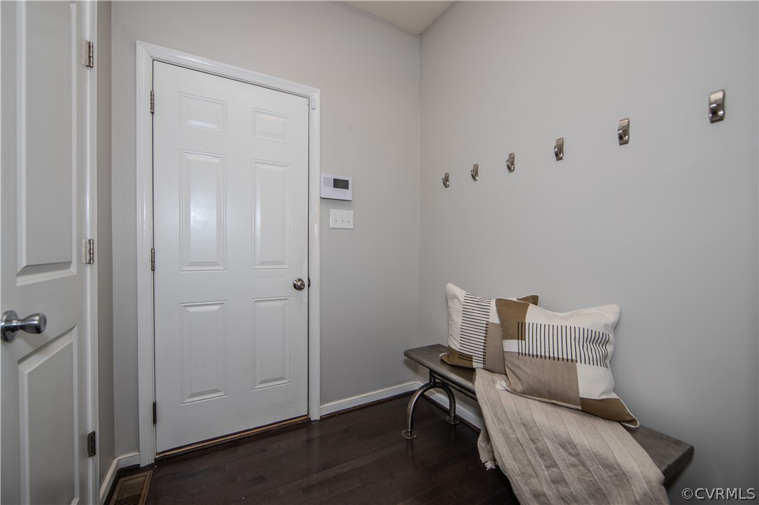 7649 Nicklaus Circle Moseley, VA 23120 - Photo 11 of 36 a room with a chair and a wooden floor