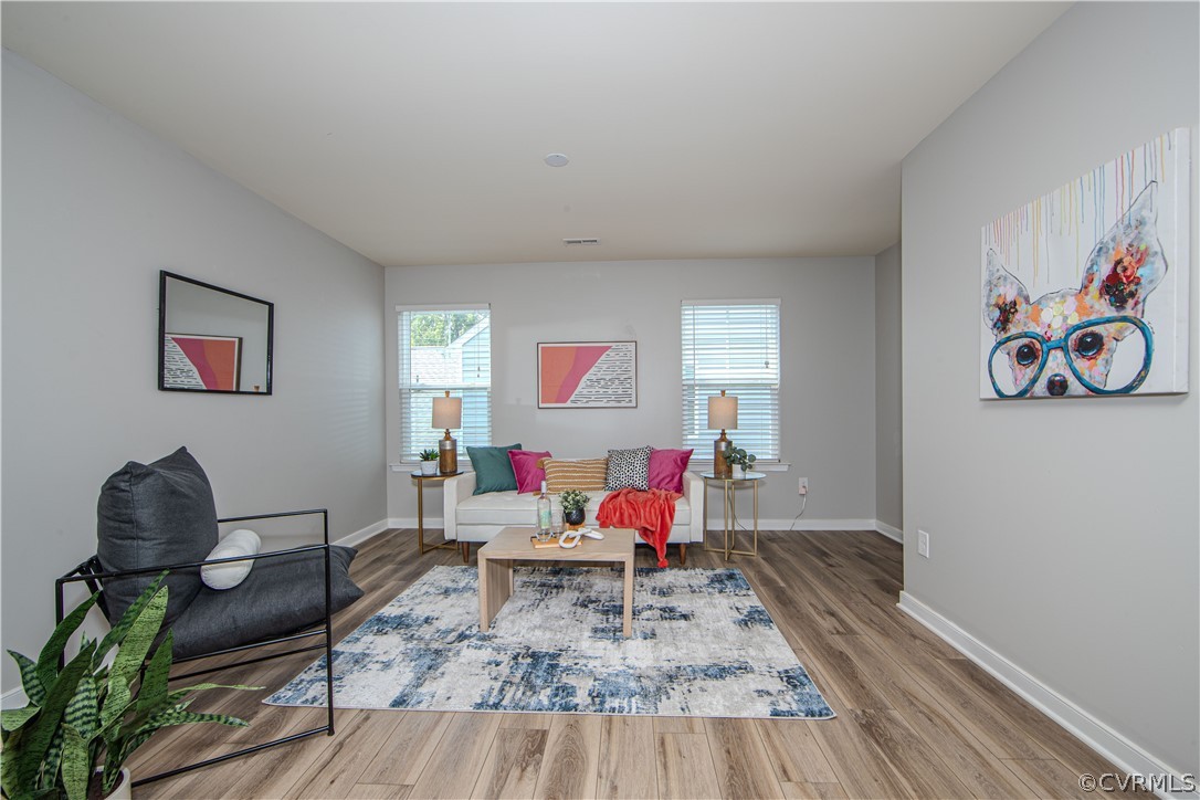 7649 Nicklaus Circle Moseley, VA 23120 - Photo 14 of 36 a living room with furniture and wooden floor