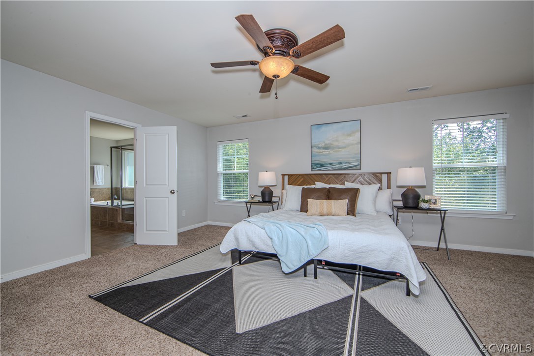 7649 Nicklaus Circle Moseley, VA 23120 - Photo 17 of 36 a bed room with a bed and a window