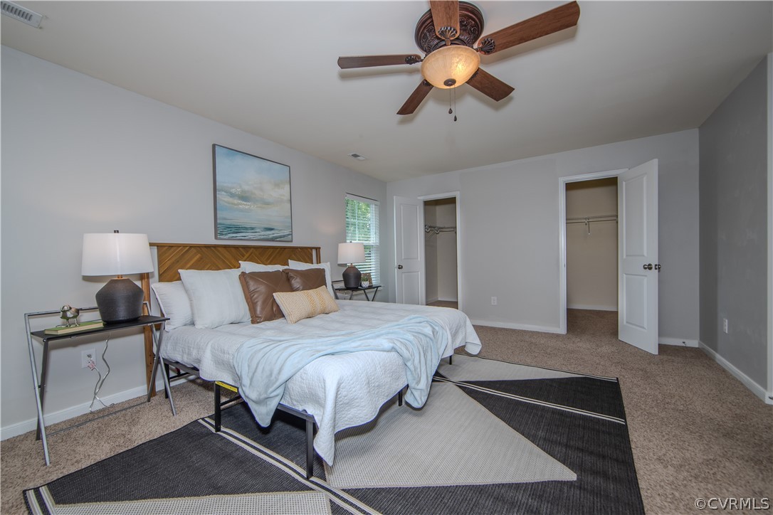 7649 Nicklaus Circle Moseley, VA 23120 - Photo 18 of 36 a bedroom with a bed and a ceiling fan