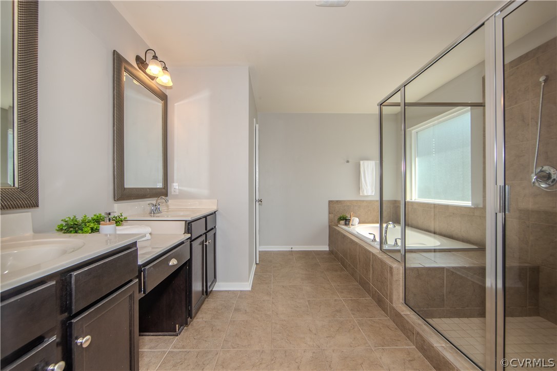 7649 Nicklaus Circle Moseley, VA 23120 - Photo 19 of 36 a spacious bathroom with a granite countertop sink mirror and double