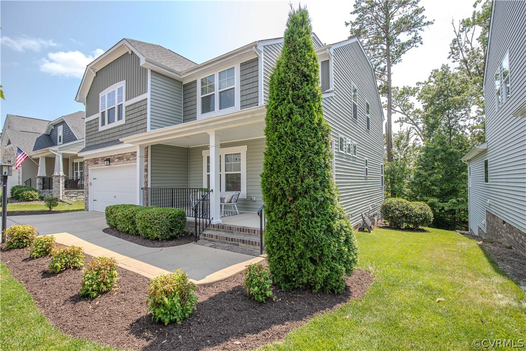 7649 Nicklaus Circle Moseley, VA 23120 - Photo 2 of 36 a front view of a house with garden