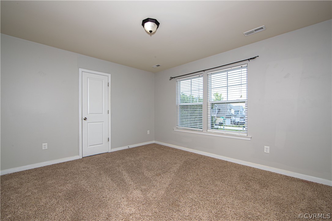 7649 Nicklaus Circle Moseley, VA 23120 - Photo 21 of 36 an empty room with windows