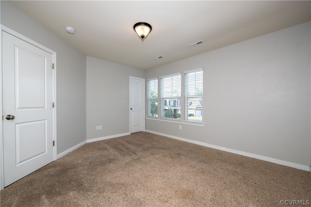7649 Nicklaus Circle Moseley, VA 23120 - Photo 22 of 36 a view of an empty room with a window
