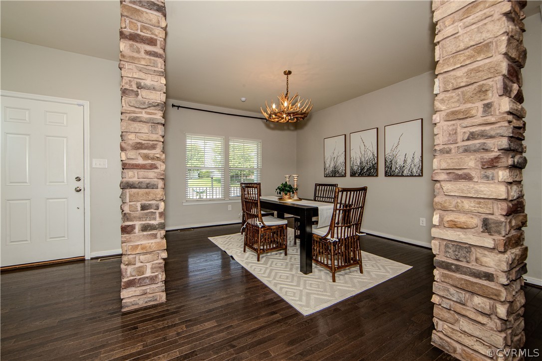 7649 Nicklaus Circle Moseley, VA 23120 - Photo 4 of 36 a view of a dining room with furniture and wooden floor