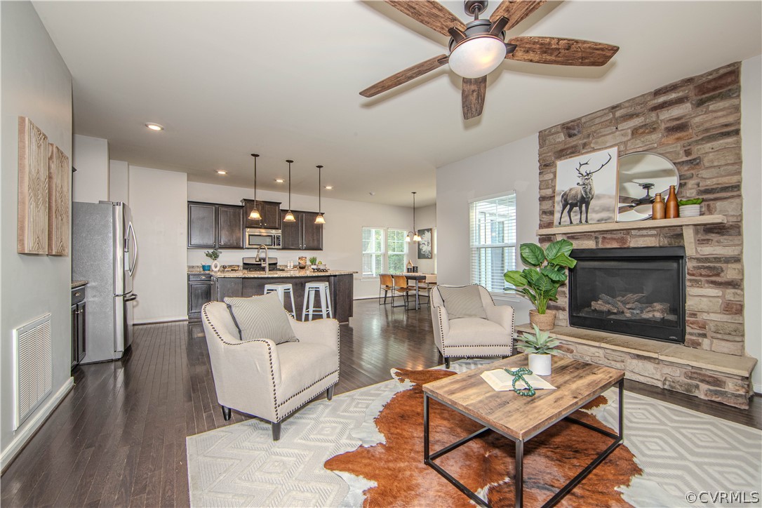 7649 Nicklaus Circle Moseley, VA 23120 - Photo 34 of 36 a living room with furniture and a fireplace