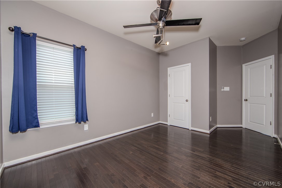 7649 Nicklaus Circle Moseley, VA 23120 - Photo 7 of 36 a view of an empty room with wooden floor and a window