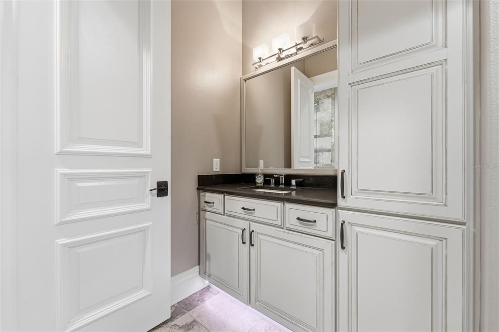 855 Southeast 87th Street Ocala, FL 34480 - Photo 42 of 79 a bathroom with a sink and a mirror