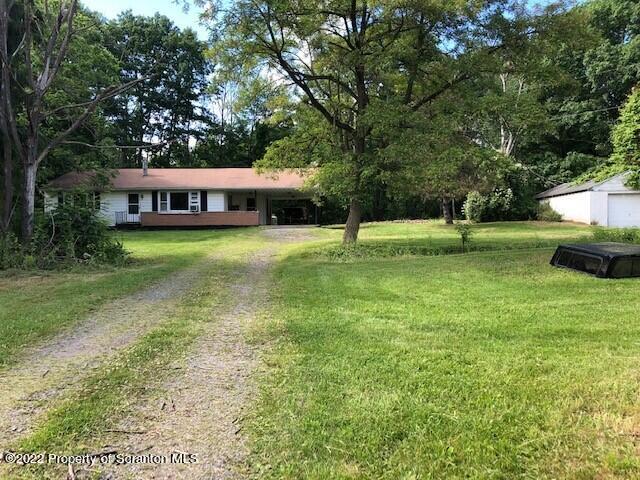 1083 Mt Cobb Road Lake Ariel, PA 18436 - Photo 2 of 23 a house view with a sitting space and garden