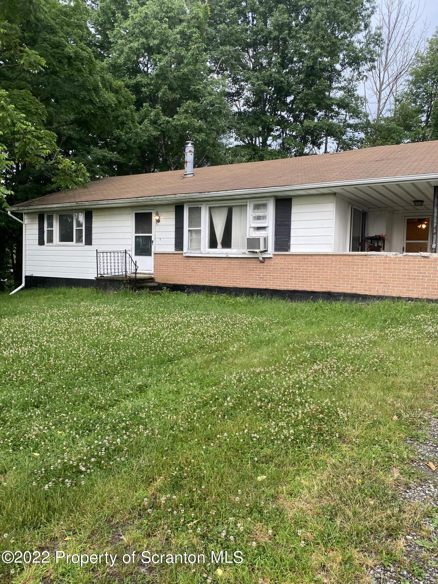 1083 Mt Cobb Road Lake Ariel, PA 18436 - Photo 3 of 23 a view of a yard in front of a house