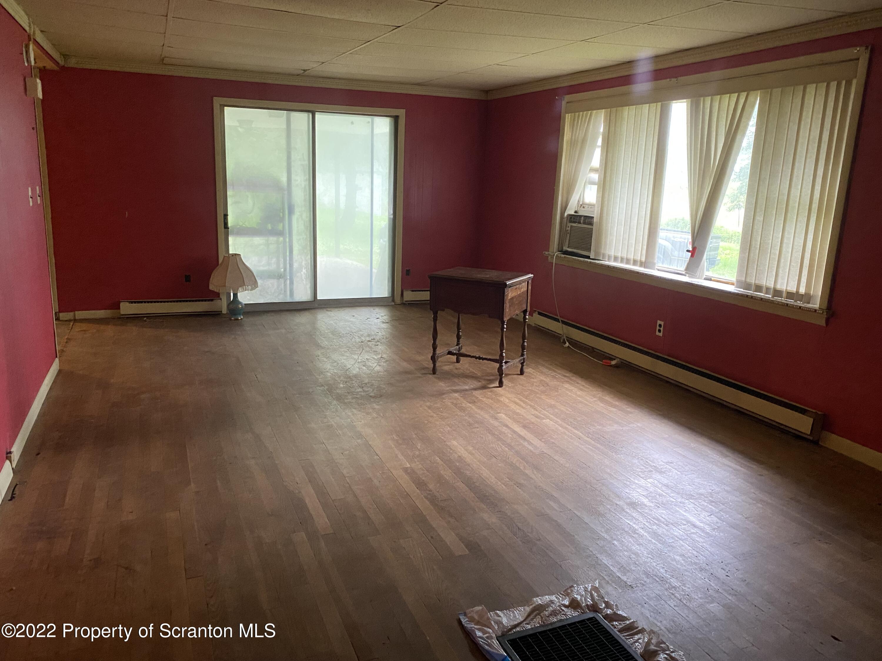 1083 Mt Cobb Road Lake Ariel, PA 18436 - Photo 8 of 23 a living room with furniture and a window