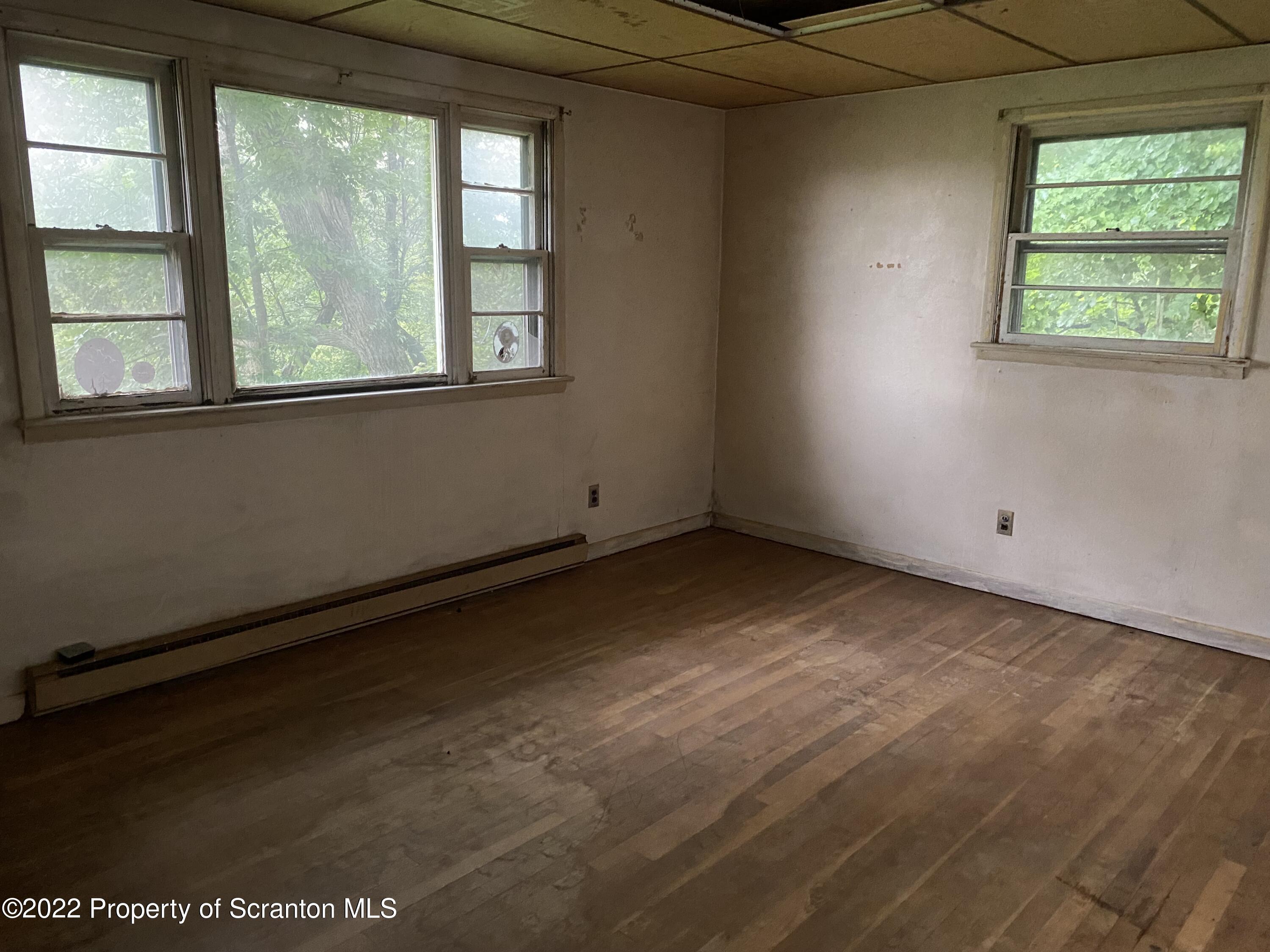 1083 Mt Cobb Road Lake Ariel, PA 18436 - Photo 9 of 23 an empty room with a window