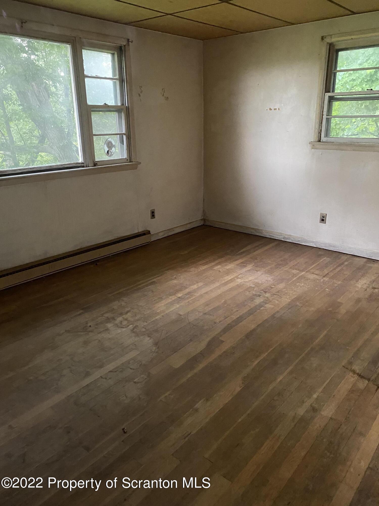 1083 Mt Cobb Road Lake Ariel, PA 18436 - Photo 10 of 23 an empty room with a window