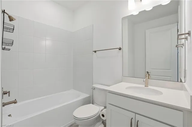 a bathroom with a sink a toilet and bathtub