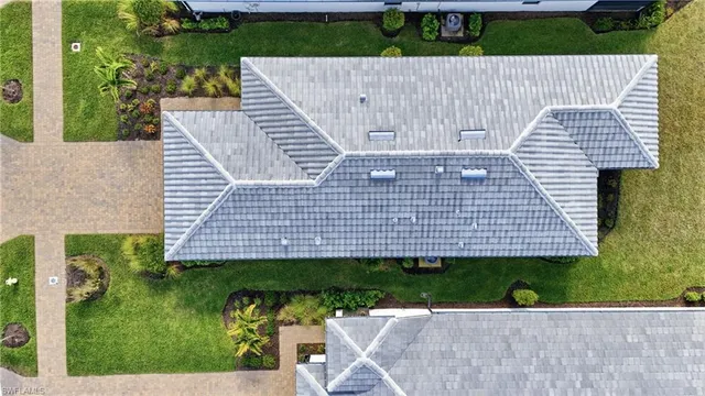 a view of a house with garden and porch