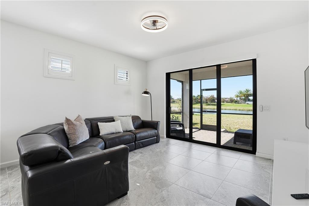 1645 Serena Avenue Naples, FL 34120 - Photo 8 of 43 a living room with furniture and a window