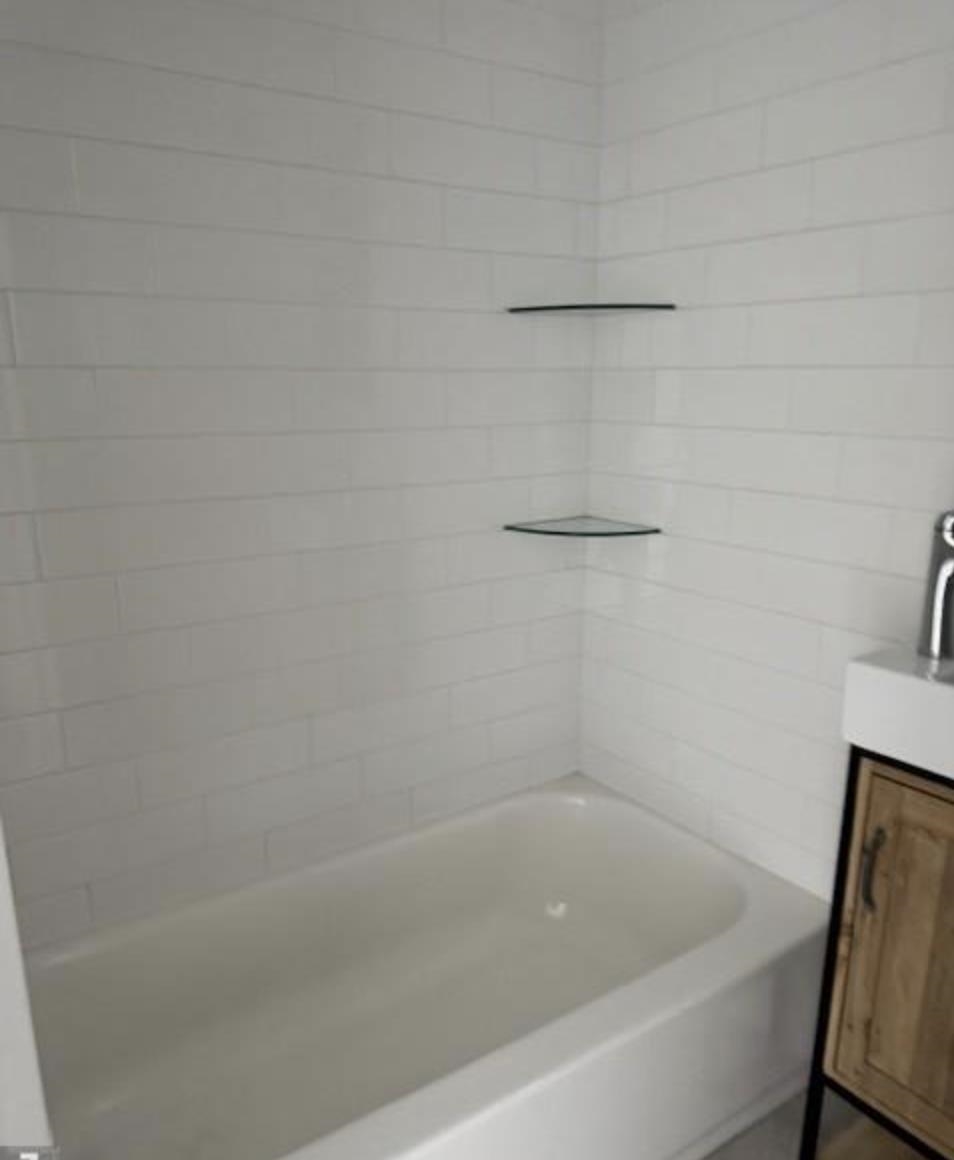 315 70th Street Guttenberg, NJ 07093 - Photo 7 of 8 a close view of a bathtub in bathroom