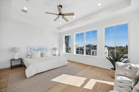 a bedroom with a large bed and a couch